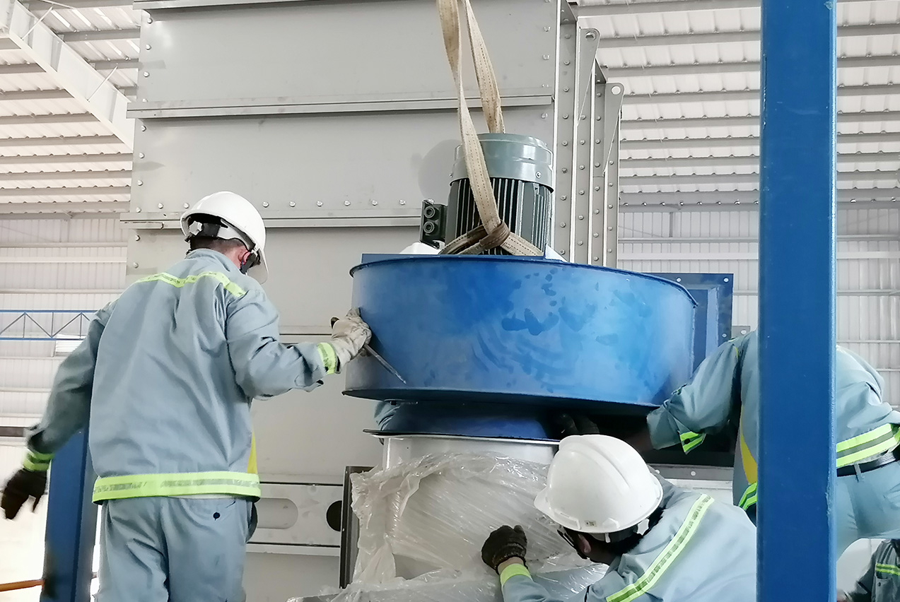 Kingwood engineering team reviewing biomass pellet plant layout drawings for a Vietnamese customer