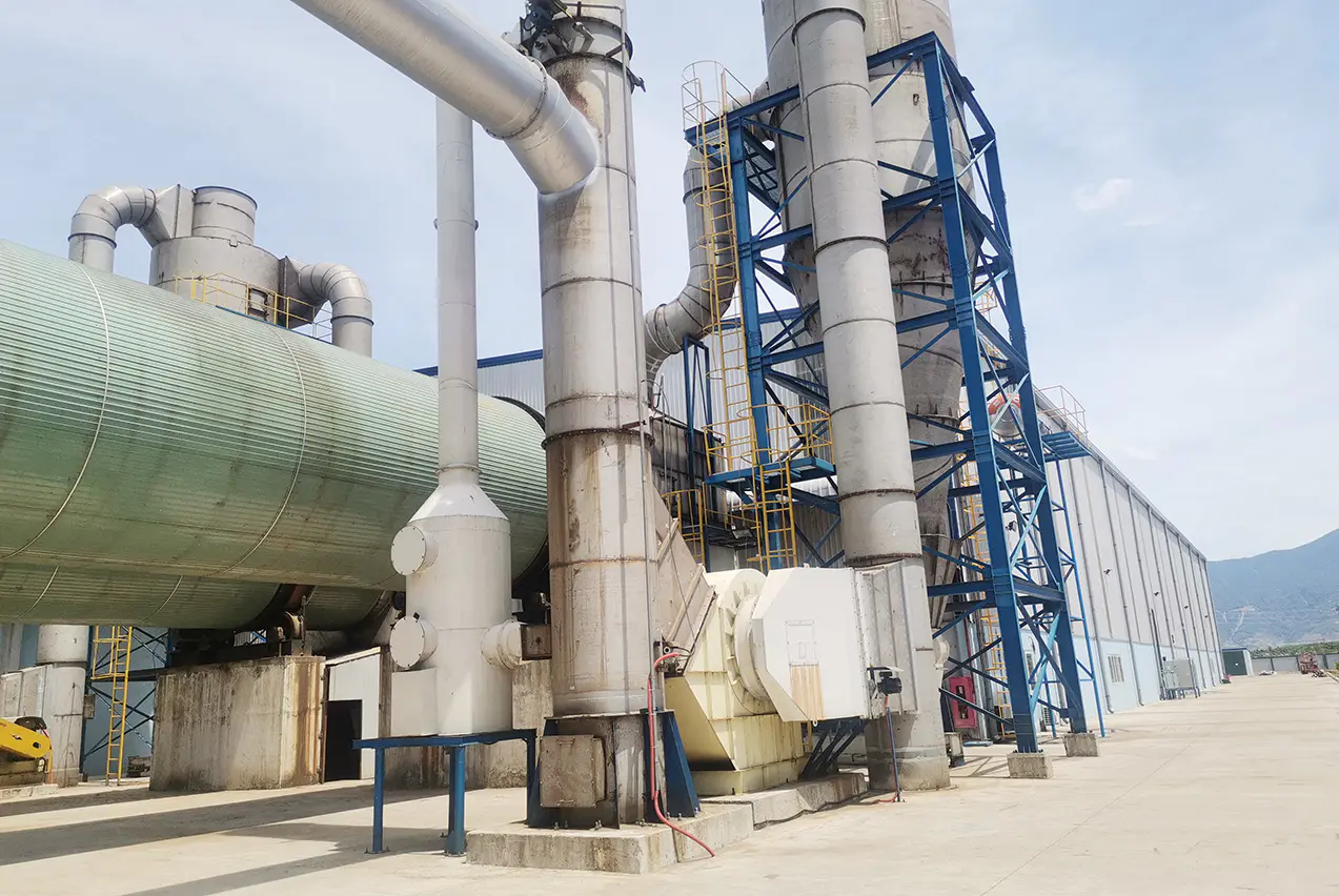 Rotary drum dryer processing fresh-cut acacia chips at a Vietnam biomass pellet facility